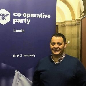 Nigel Gill by a Leeds Co-operative Party banner